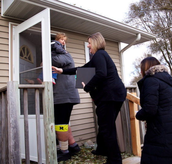 UMCOR case managers make a home visit.