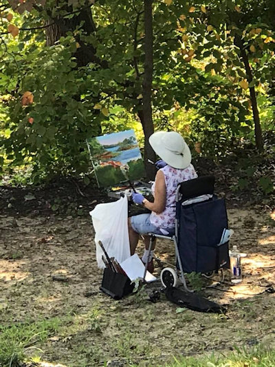 Woman painting at Wesley Woods Camp