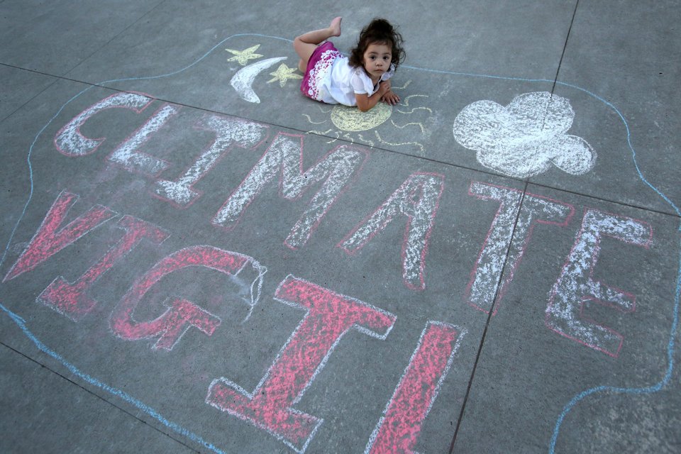 A toddler at the Climate VIgil at the 2016 General Conference