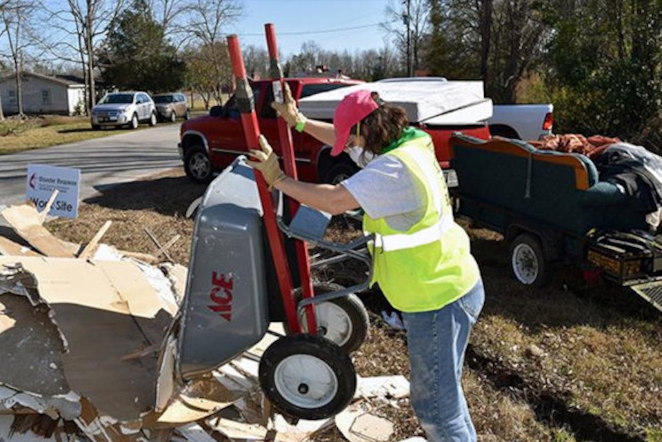 Woman cleaning up after storm