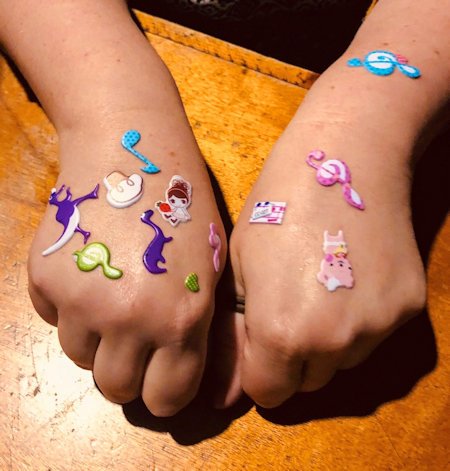 Children's hands with stickers