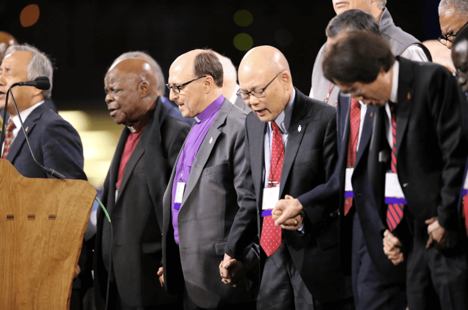 Bishop Bard prays with Council of Bishops at GC 2019