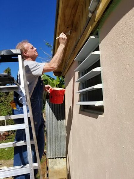 Volunteer painting a home in Puerto Rico