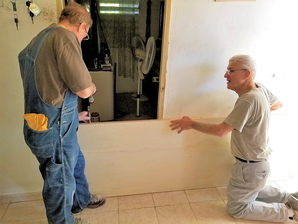 Volunteers working on hurricane damaged home in Puerto Rico