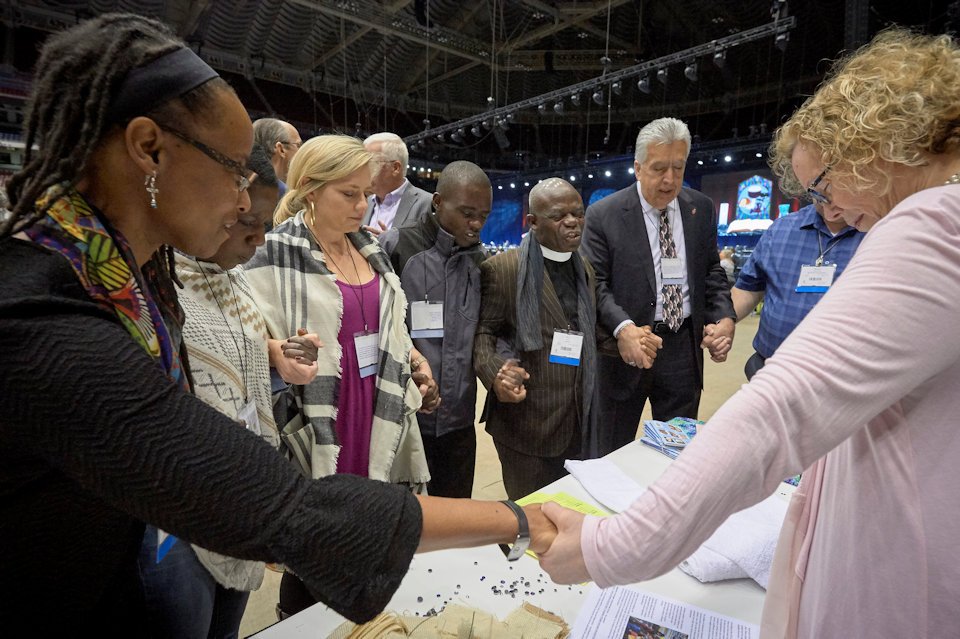 Kennetha Bigham-Tsi in a prayer circle at GC 2019