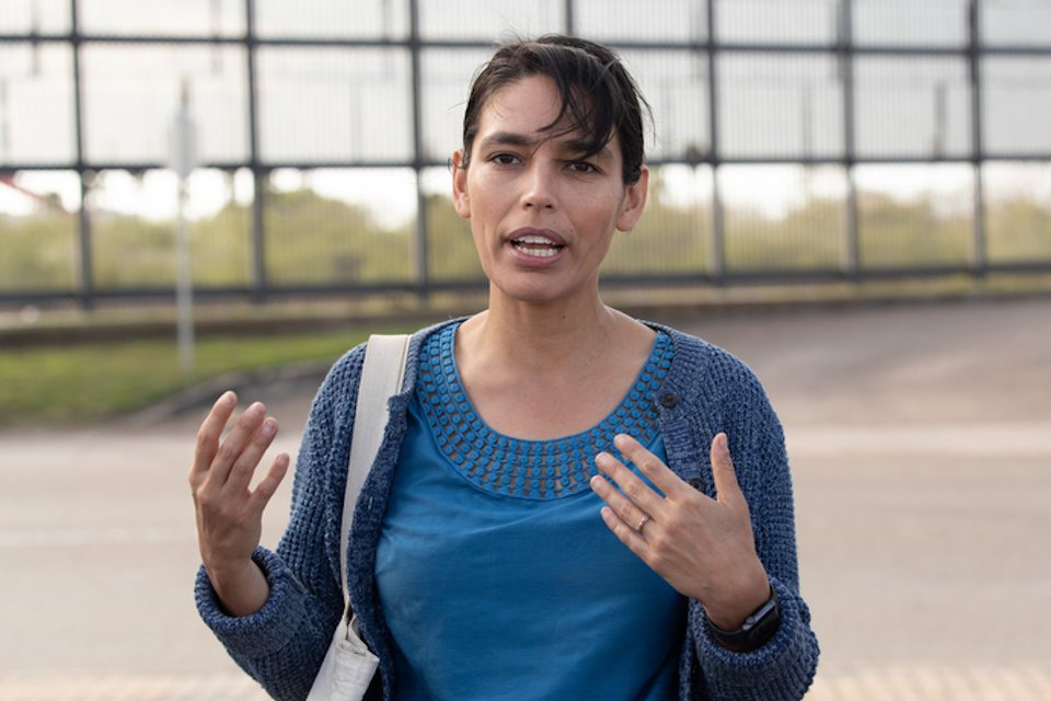 Woman working with asylum seekers at the border.