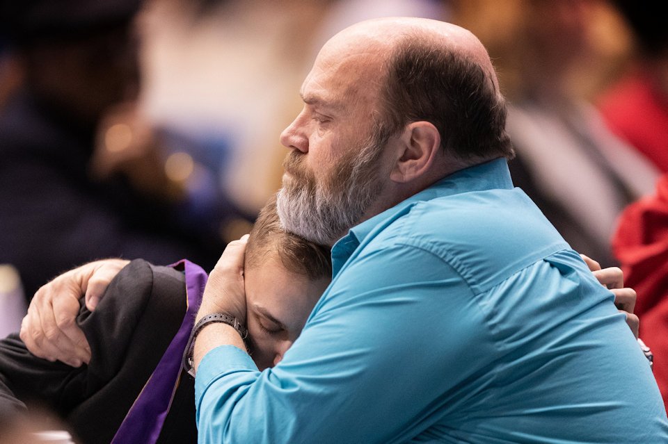 Two delegtes from Upper New York Conference embrace during Monday's afternoon session.