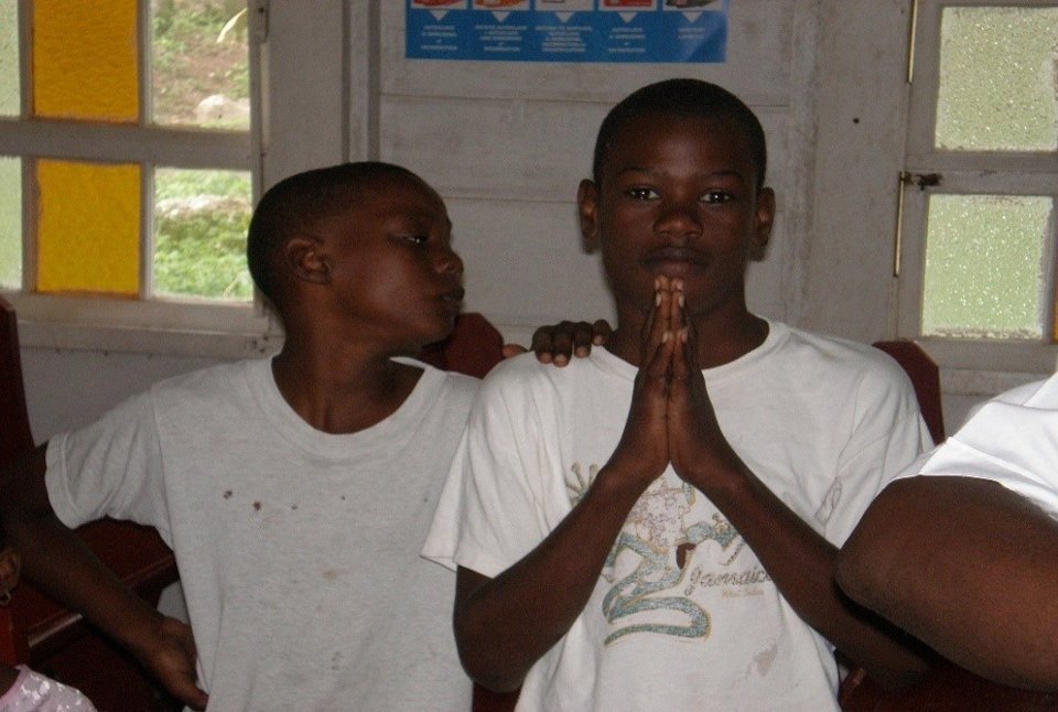 Jamaican boy praying