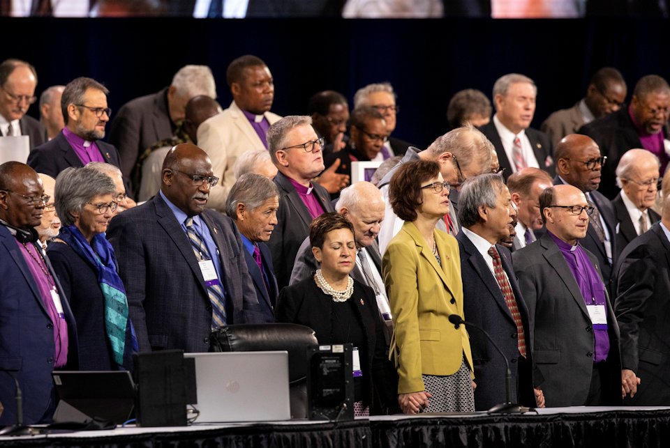 Bishops praying at Gener alConference 2019