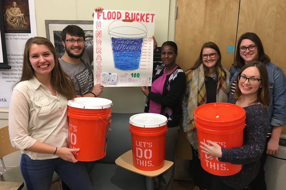 University students with Cleaning Buckets