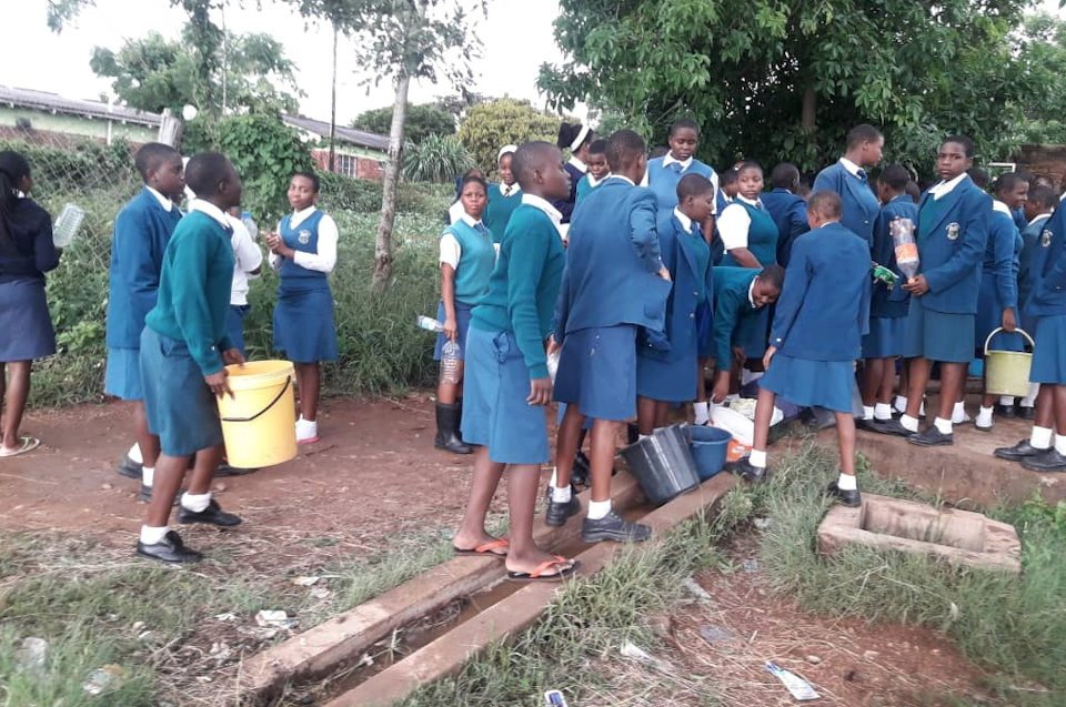 Girls collecting water.