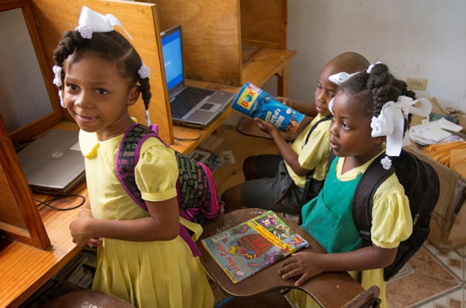 Haitian school children with books