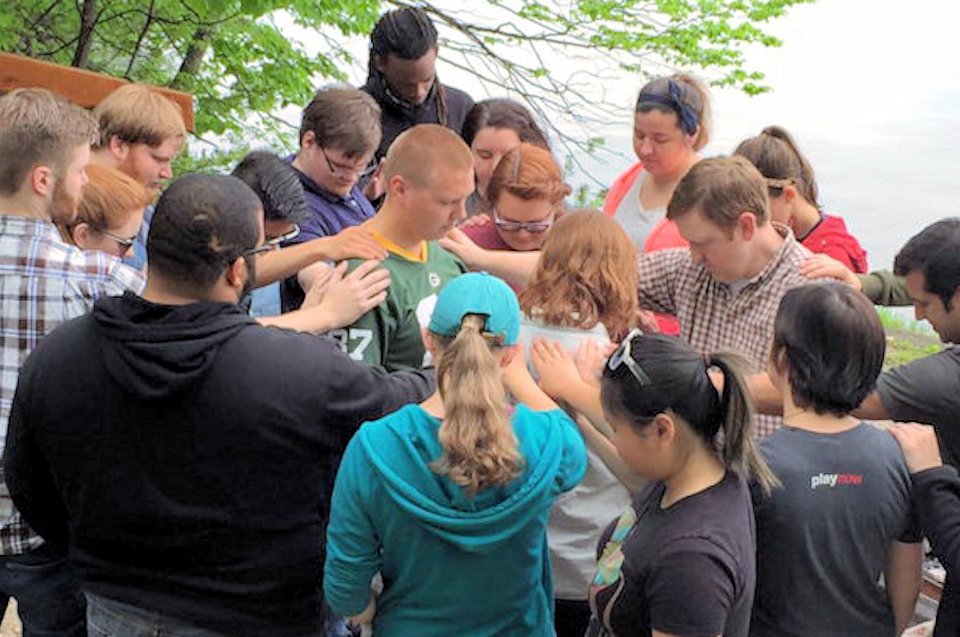 Mission Interns being blessed during training at Lake Louise