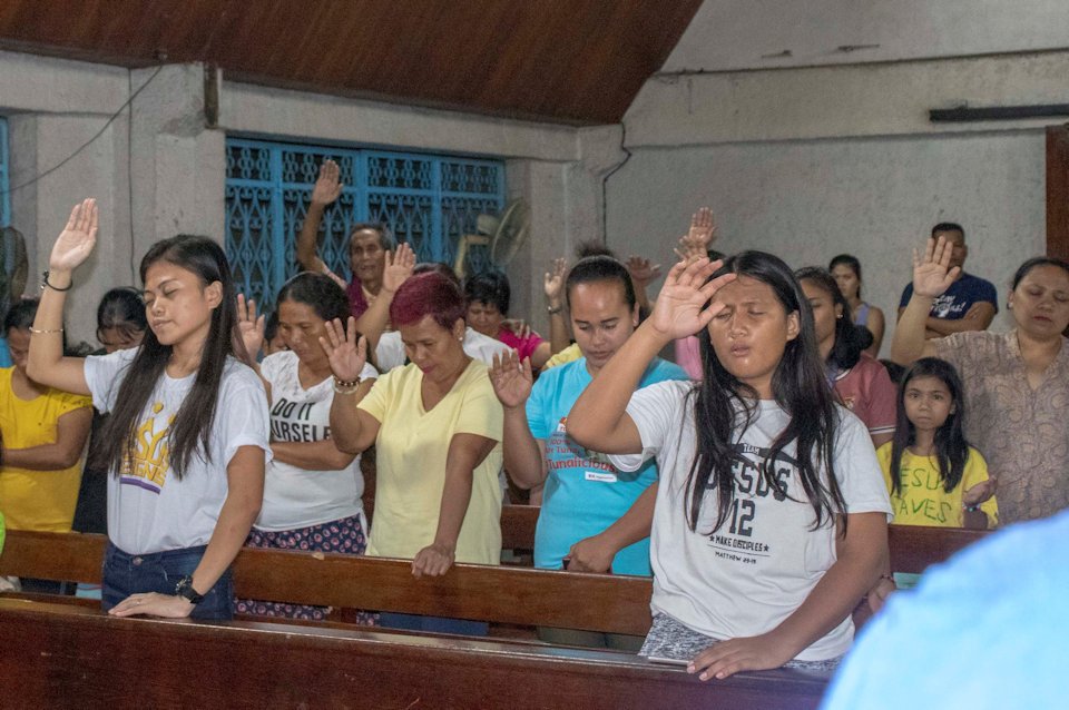 Filipino people in worship.