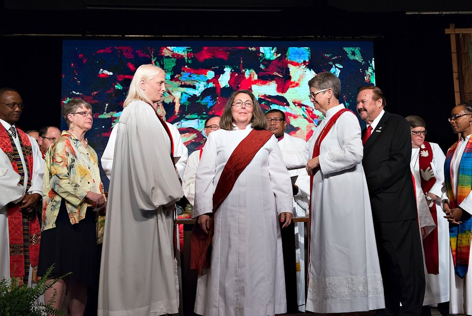 Woman being ordained a deacon in the United Methodist Church