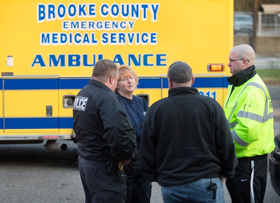 EMTs talking with police