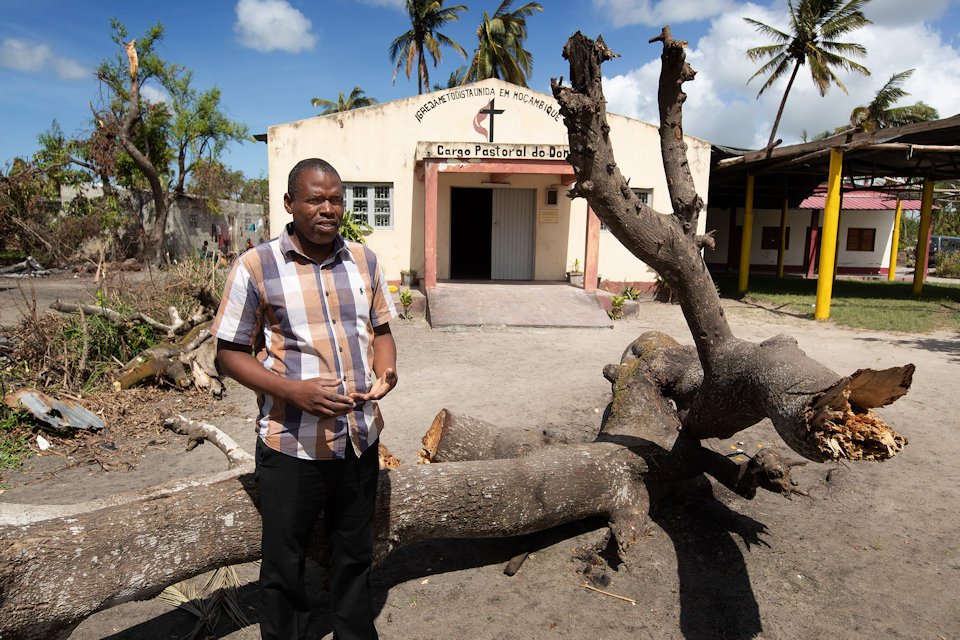 Pastor in front of church in Mozambique