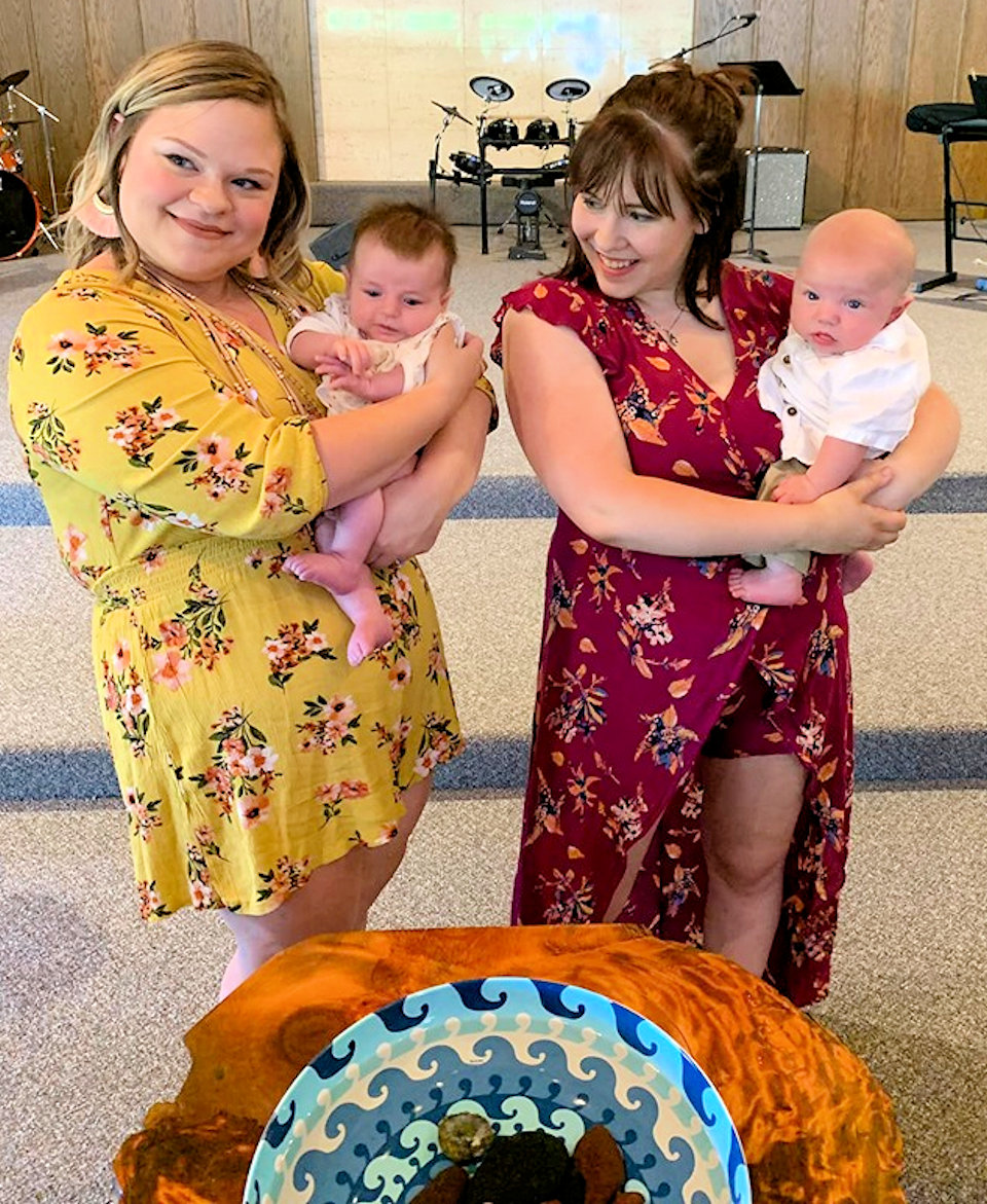Two babies at baptism