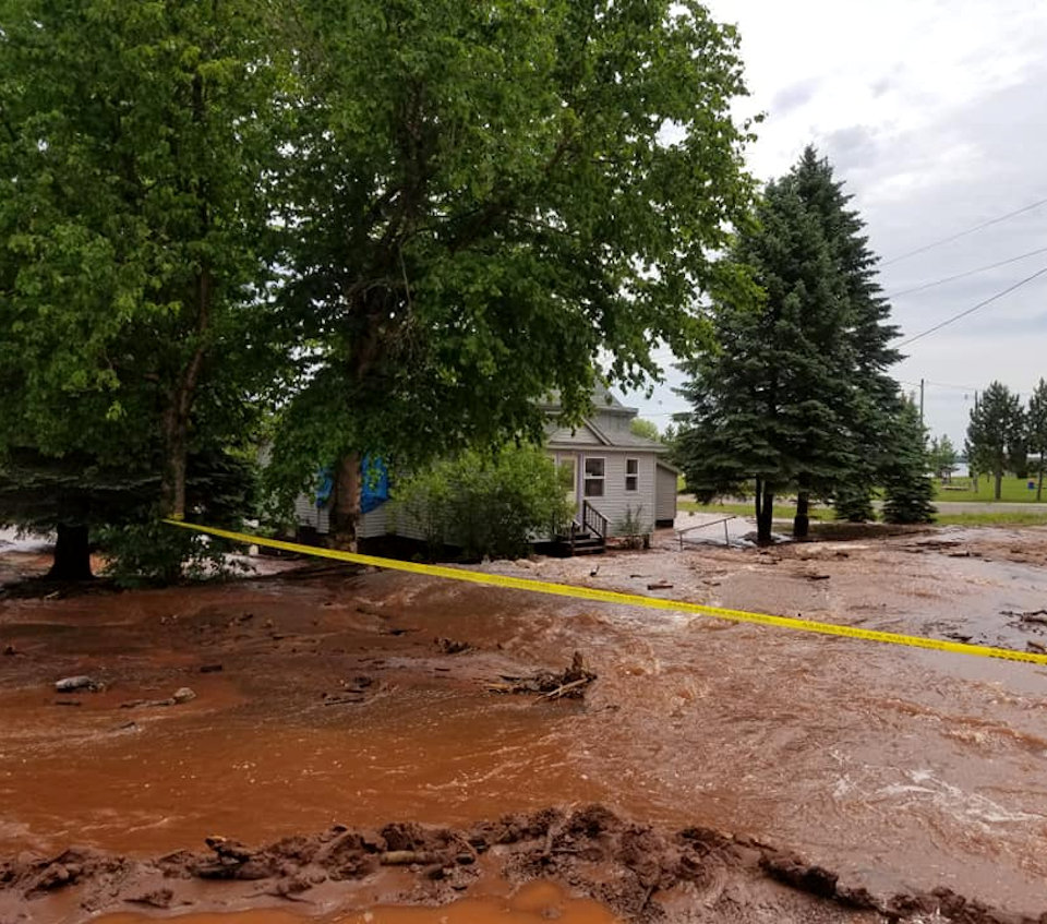 Home surrounded by mud