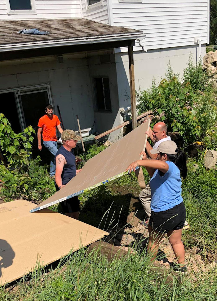 Volunteers work in flood recovery in Wisconsin