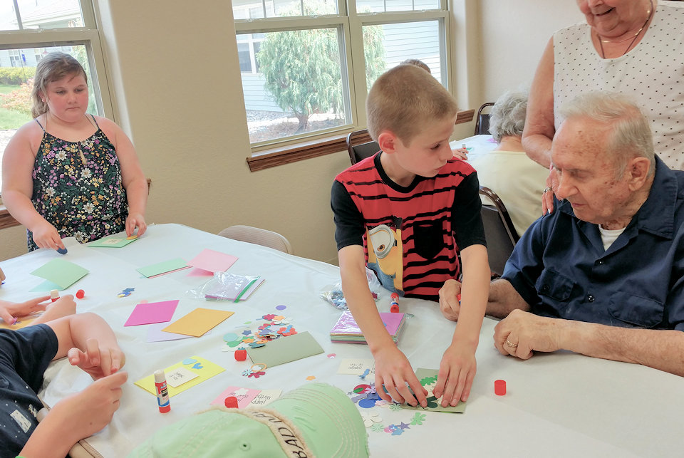 children interact with older adults at GAP