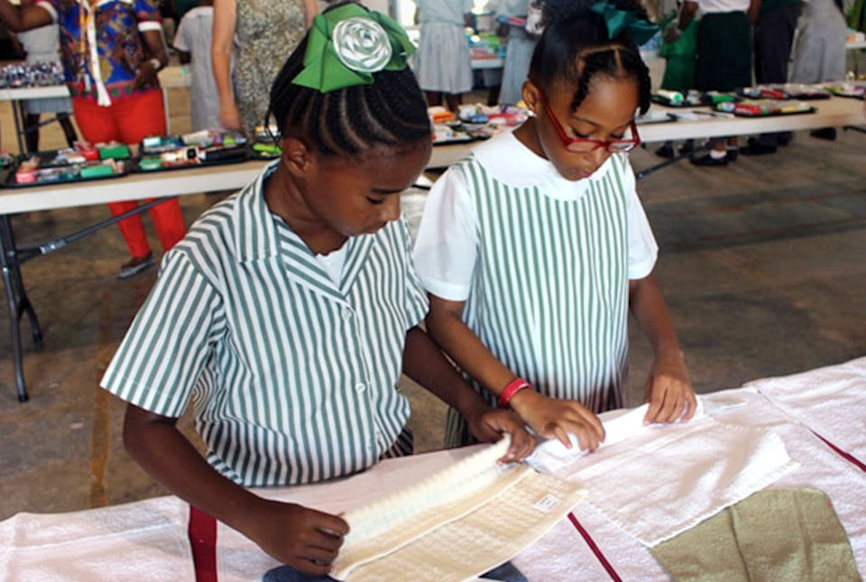 Girls packing health kits for Bahamas