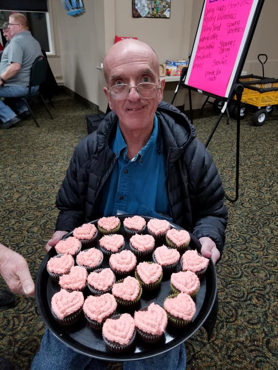 man with cupcakes