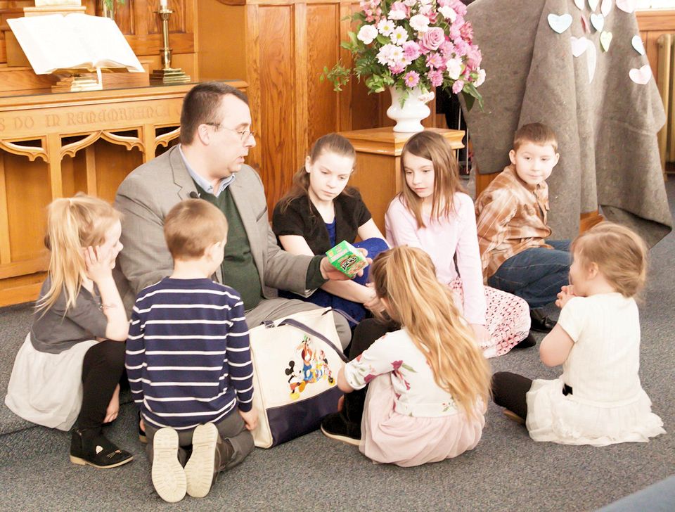 Pastor with children