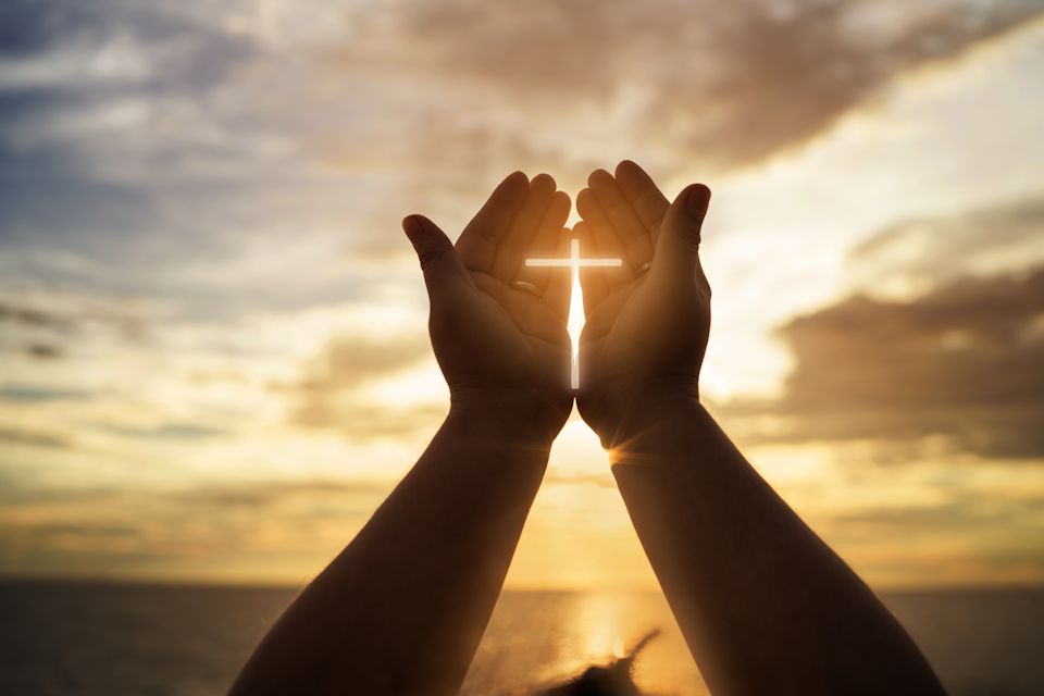 Hands make cross for Lent