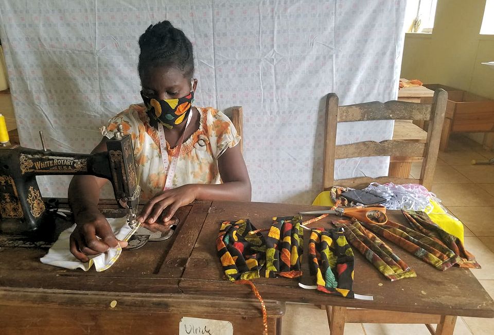 Heroes in Haiti sewing masks