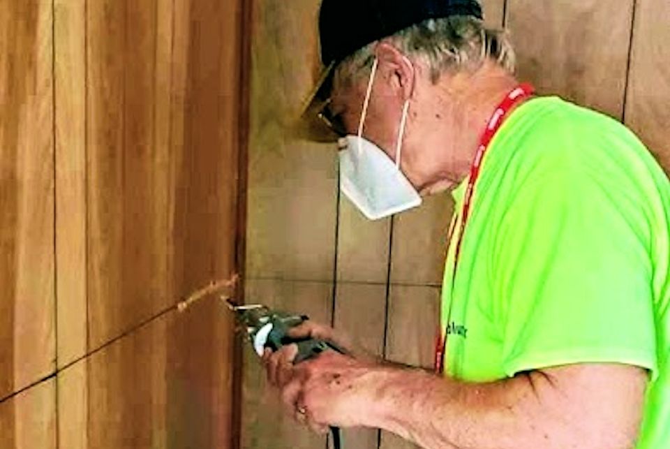 Early responder works on wall in Gladwin