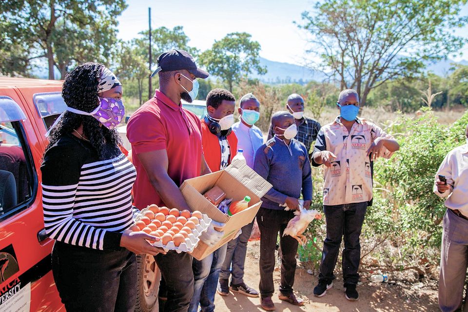 Africa U students distribute food