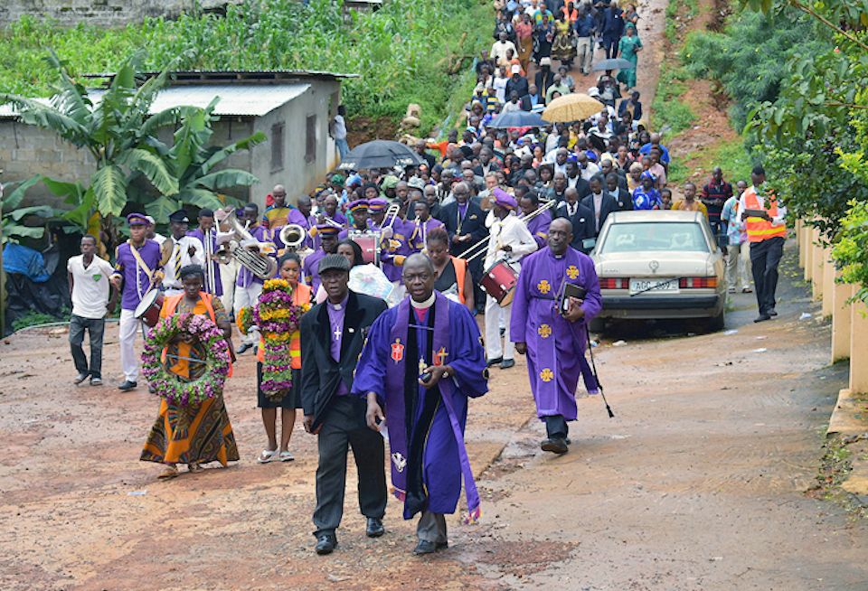 Bishop Yambasu at worship at Landslide