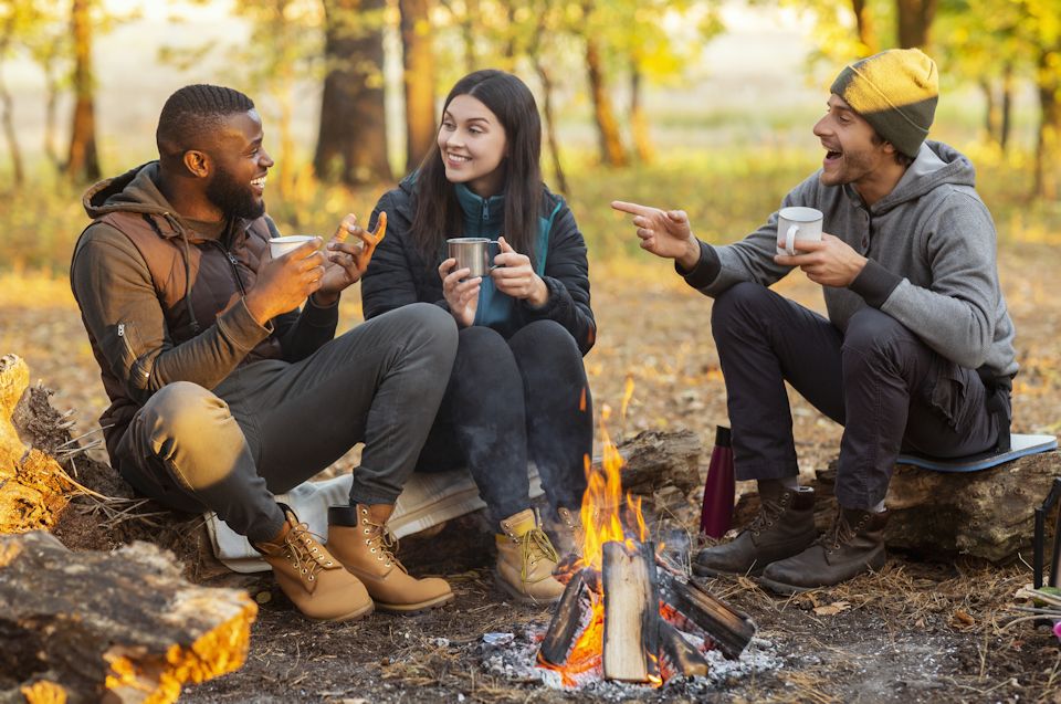 Faith and friendship burning around campfire