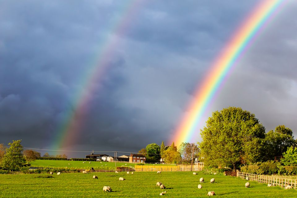 Rainbow in a dark cloudy sky offers hope