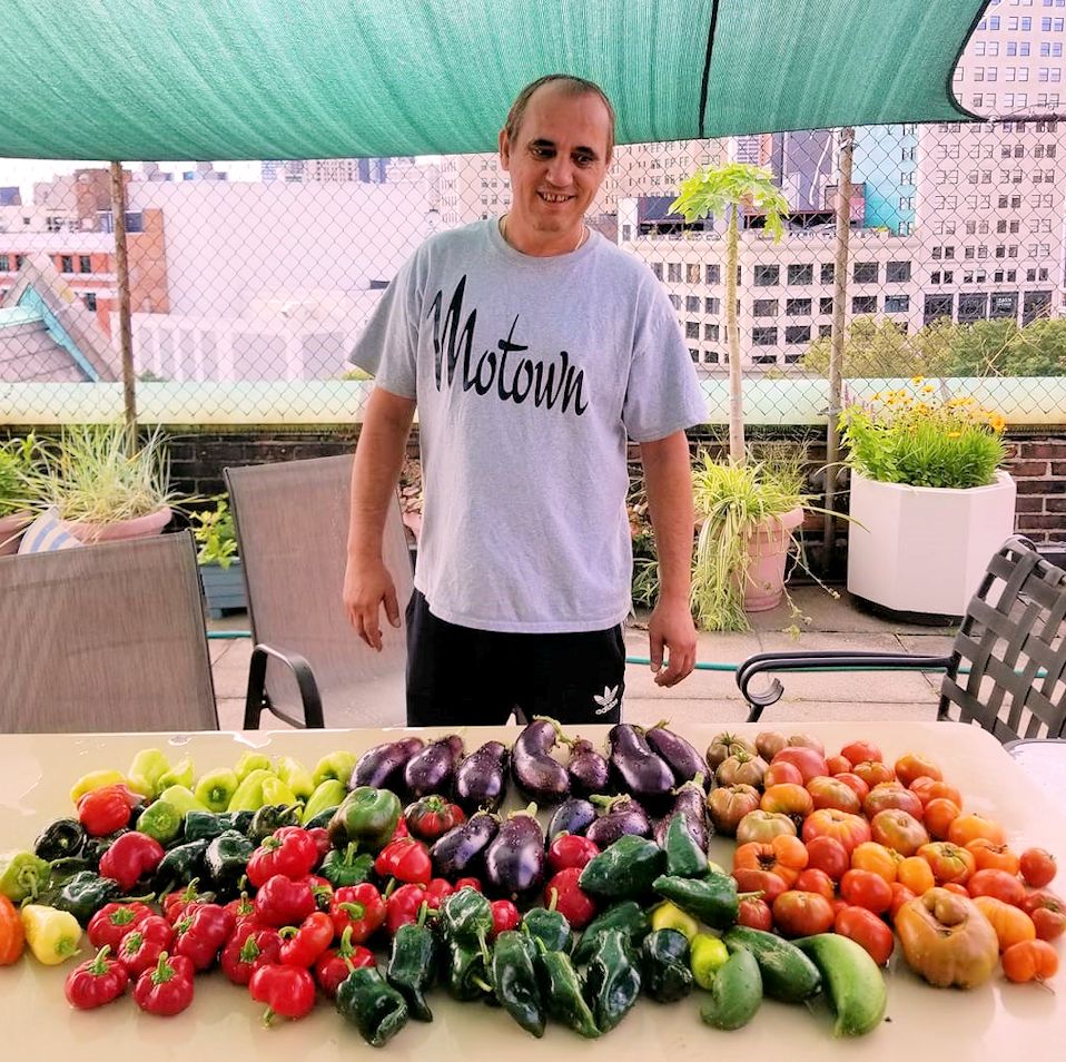 Deb with the produce from his rooftop garden in downtown Detroit.