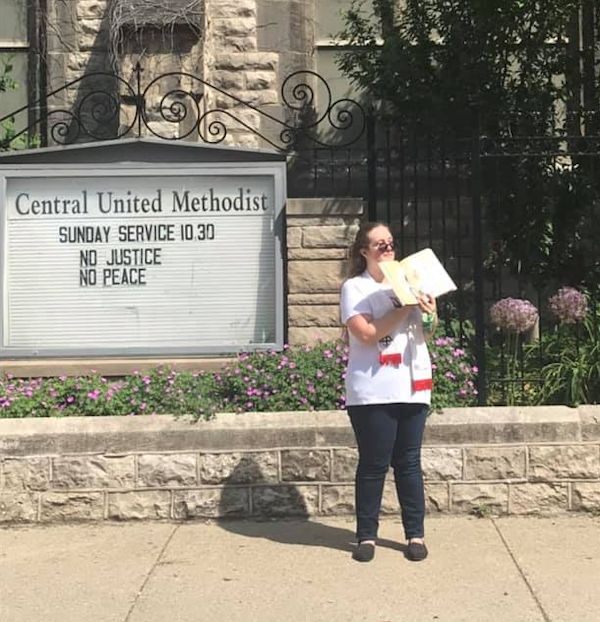 Deaconess Anne Hillman on sidewalk