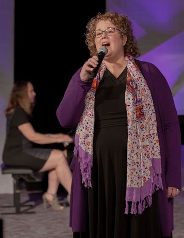 Christy Miller-White Singing during memorials