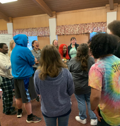 Mission interns play a team-building game.