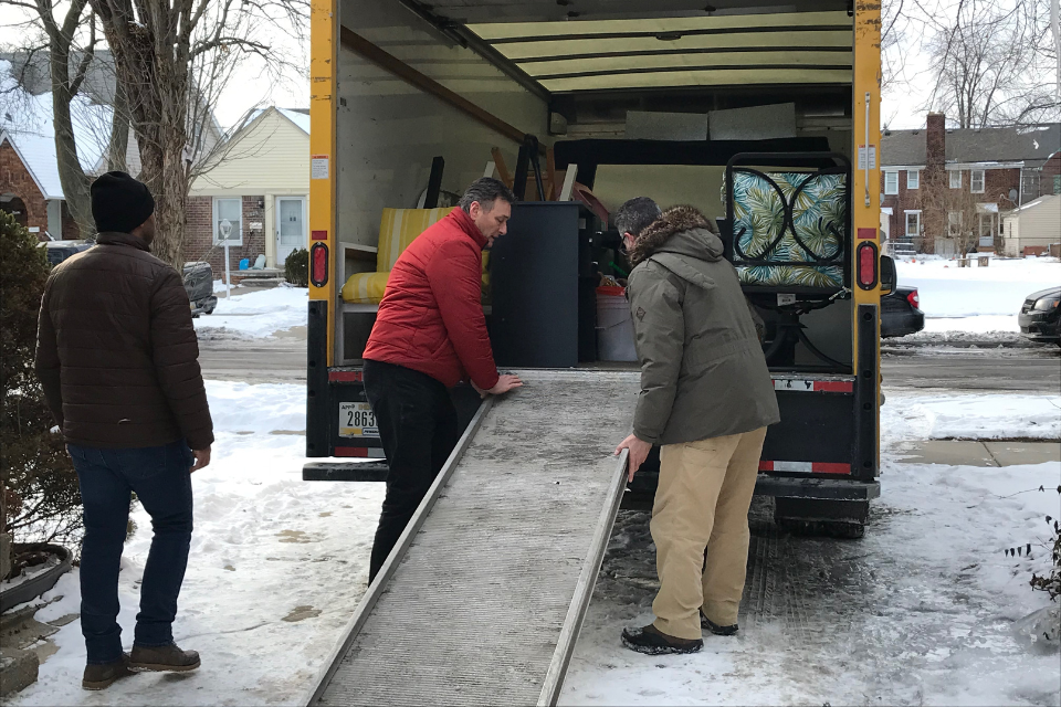Members of Dearborn First UMC help refugees move to a safe place.