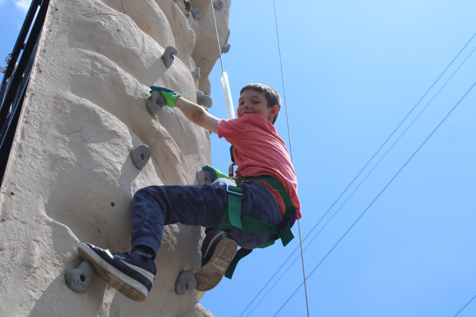 Kid on climbing wall