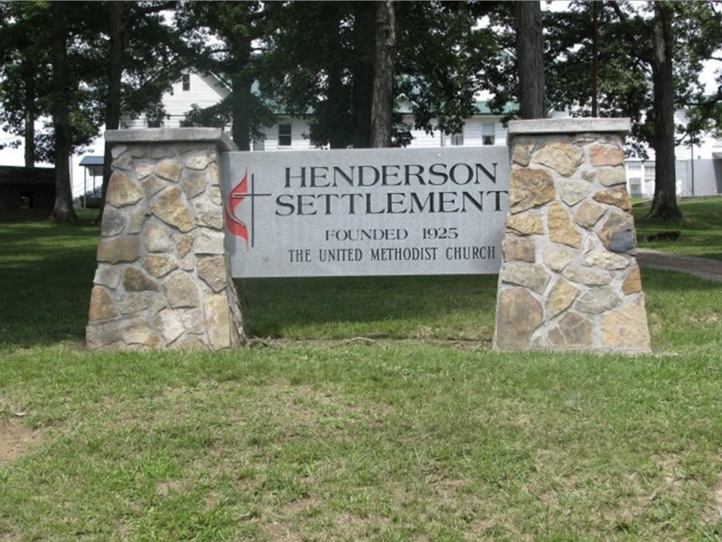 Outdoor sign that reads "Henderson Settlement. Founded 1925. United Methodist Church."