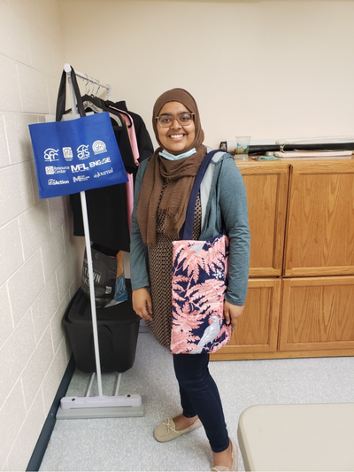 Woman showing her bag that she made