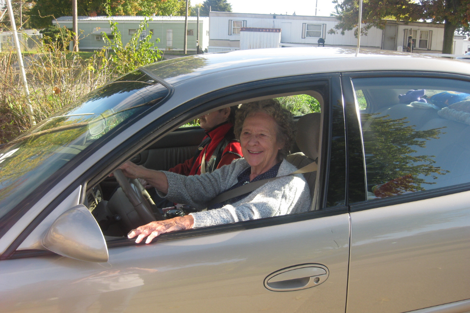 Volunteer providing a free car ride.