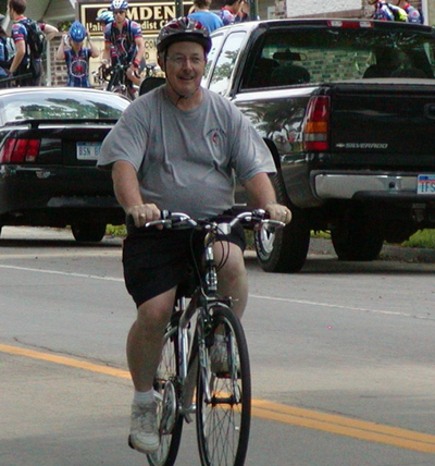 Pastor Ed Mohr riding a bike