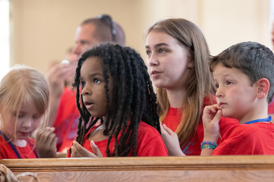 Children listening during vacation Bible school