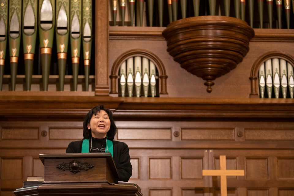 Woman preaching from pulpit