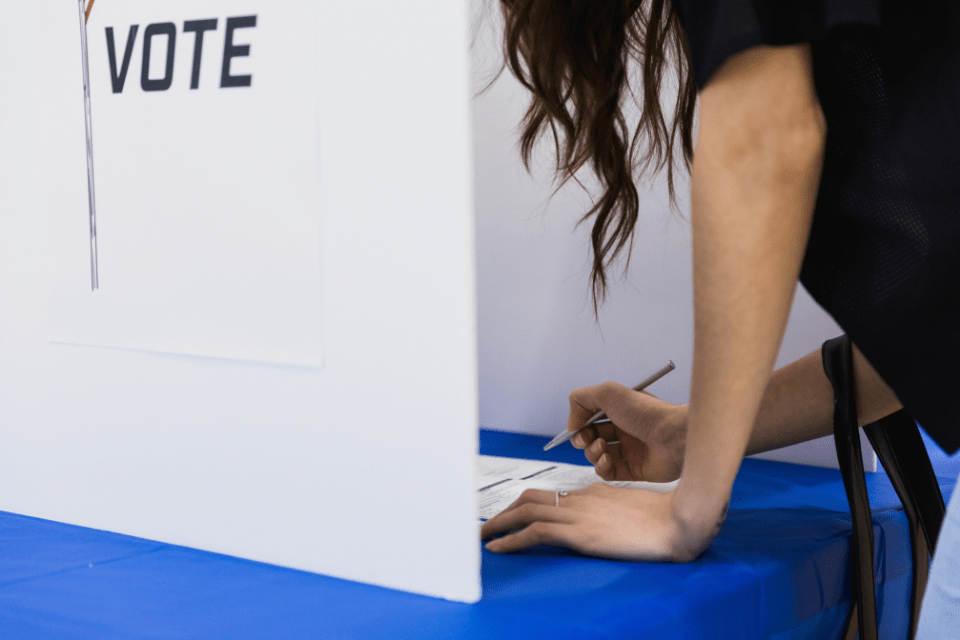 Woman in voting booth