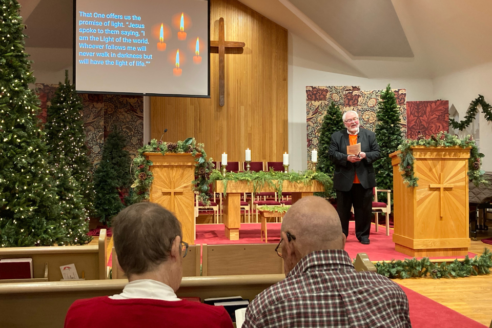 Lighting candles during a service of remembrance