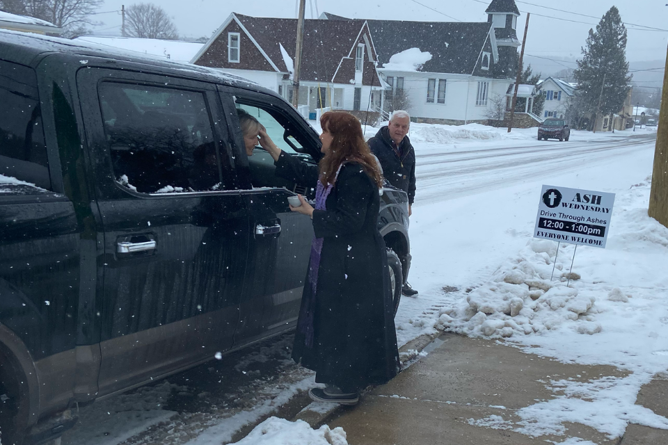 Pastor offering the imposition of ashes on Ash Wednesday